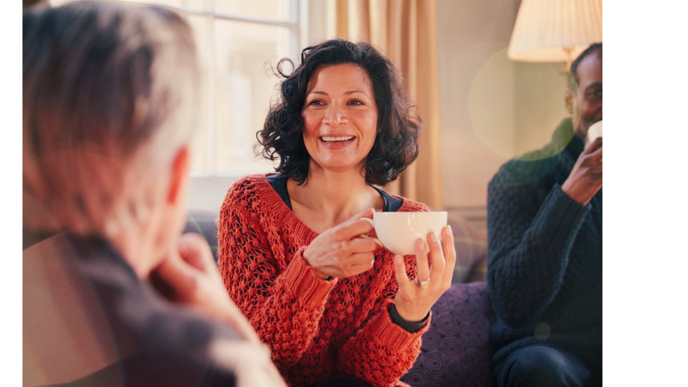 Warm conversation over tea in a cozy group setting